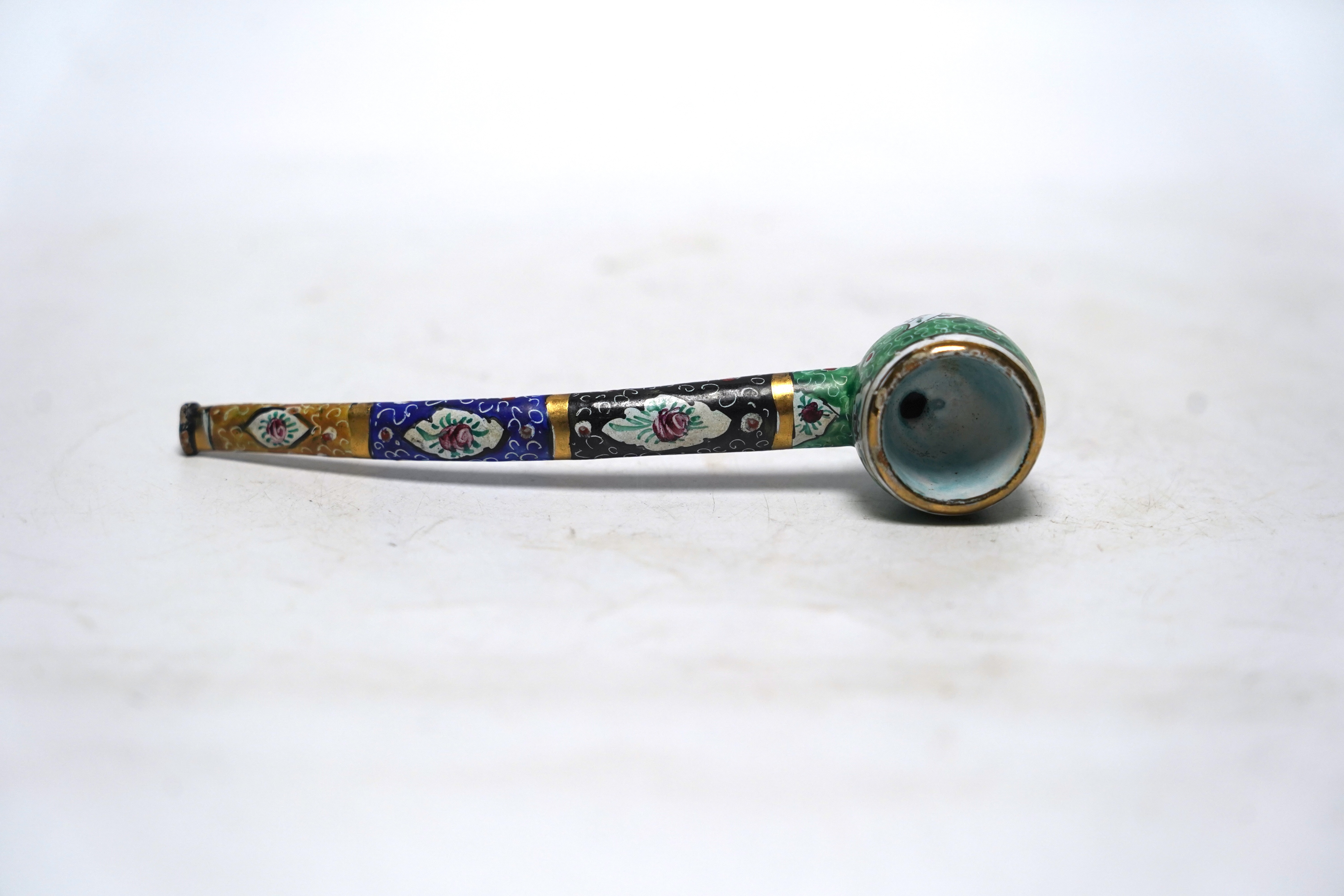 A Persian multicoloured enamelled pipe, 14cm long